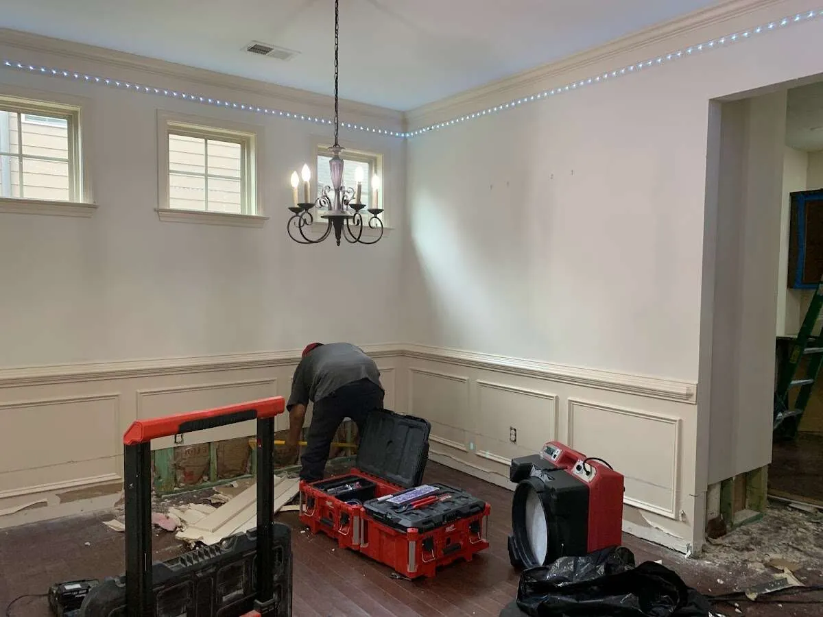 Restoration technician with professional equipment in Lawrenceville